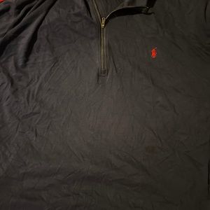 Polo with red striped, going down arm and shoulder
